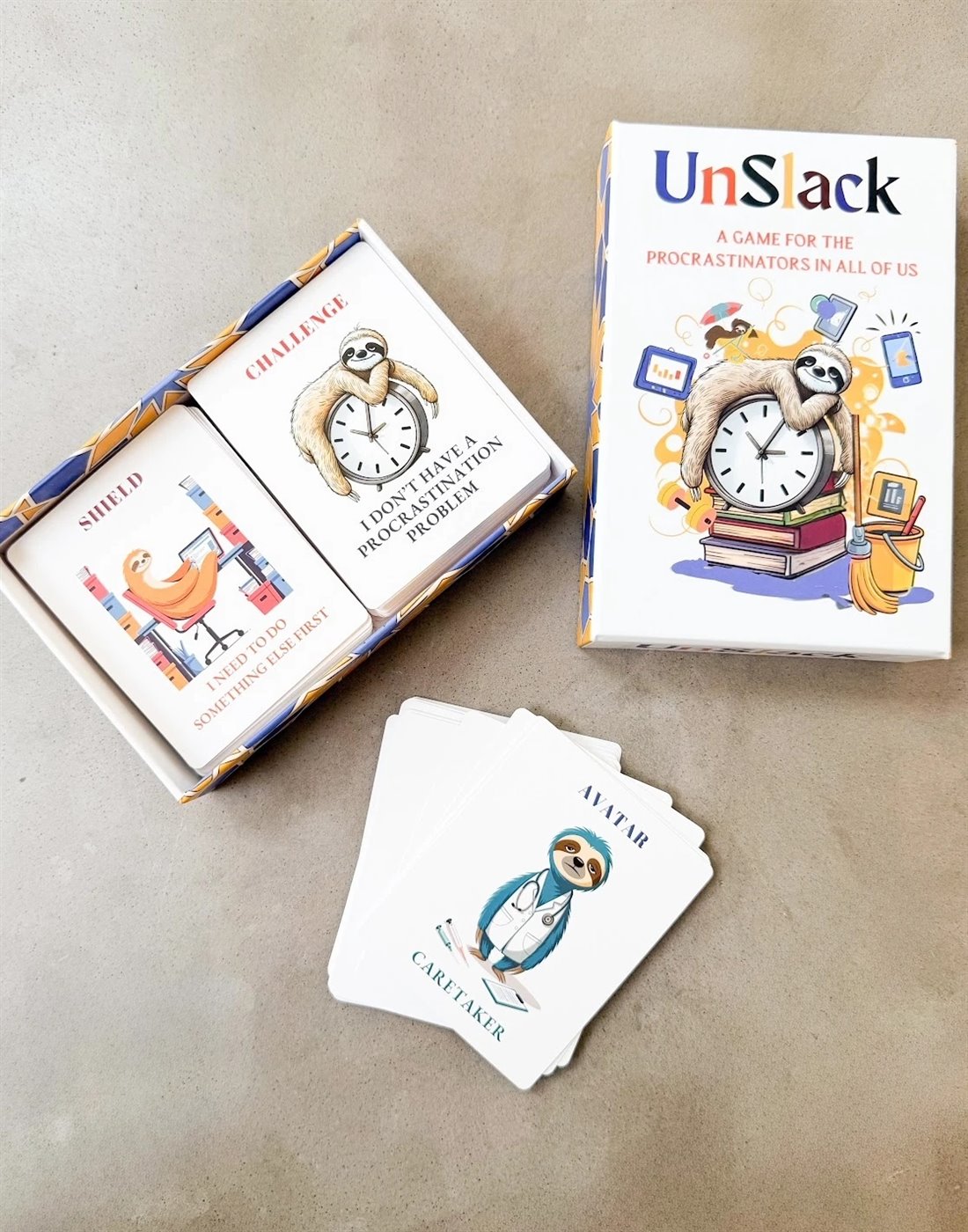 The open Unslack box with Shield and Challenge cards inside, and a fan of Avatar cards beside it