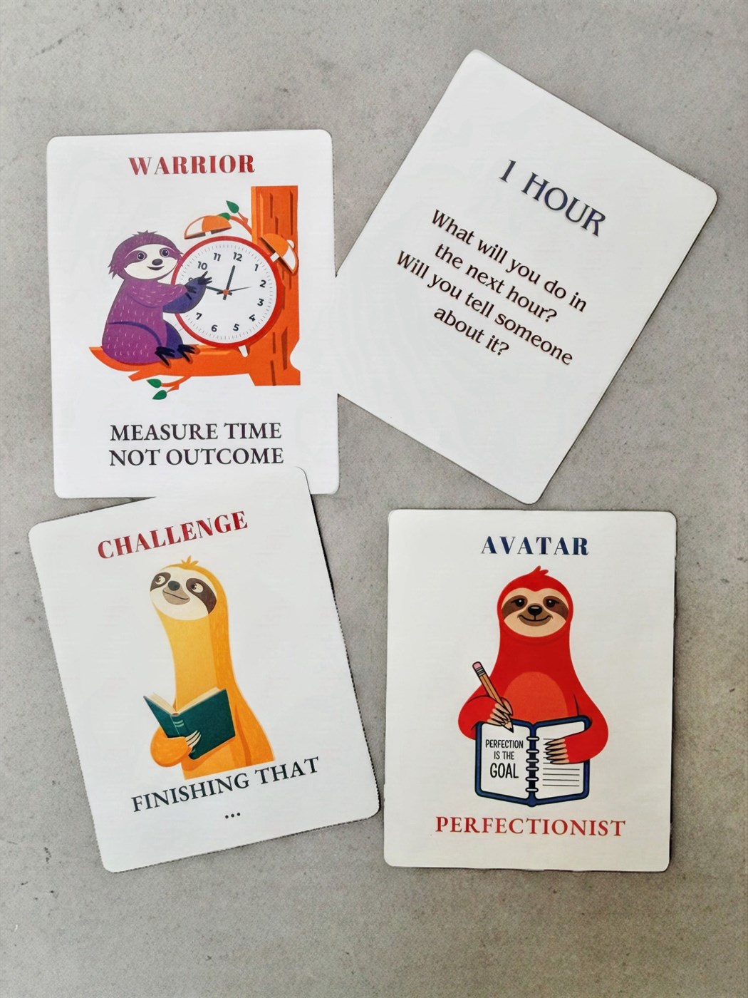 Four Unslack cards laid out on a surface, including a Warrior card and an Avatar card